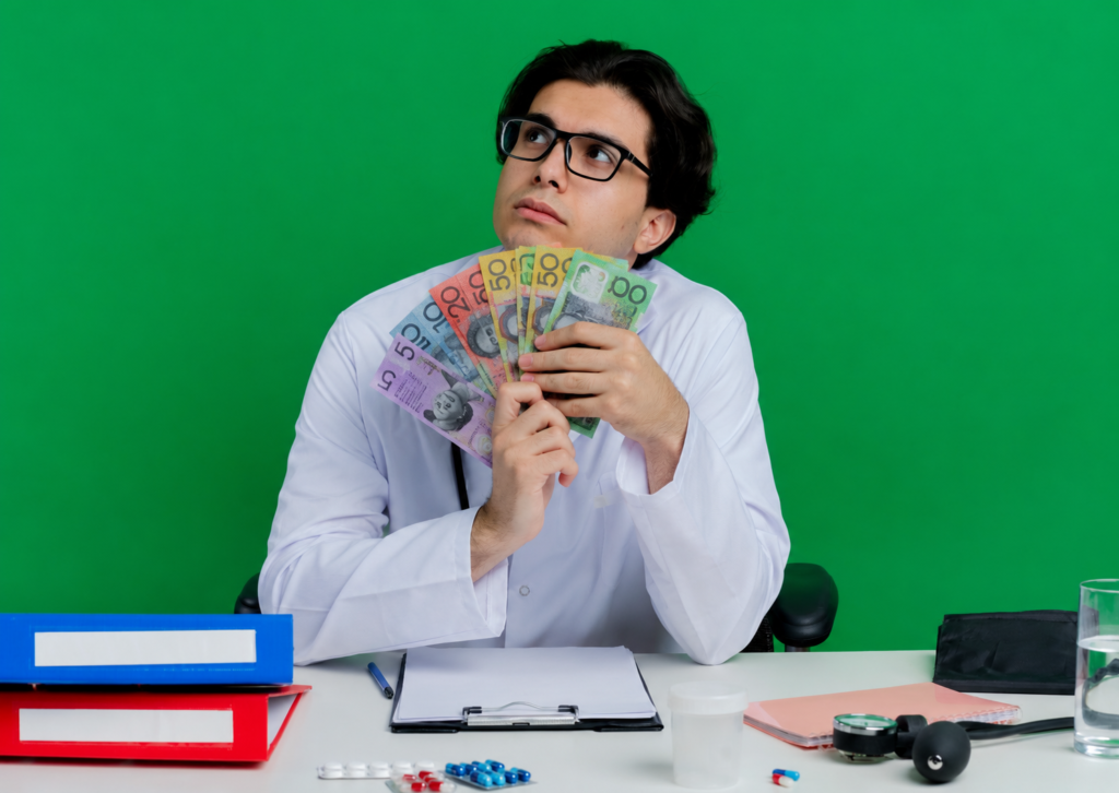 Professional holding Australian dollar banknotes at an office desk, representing debt recovery and cash flow solutions for Western Australian businesses.