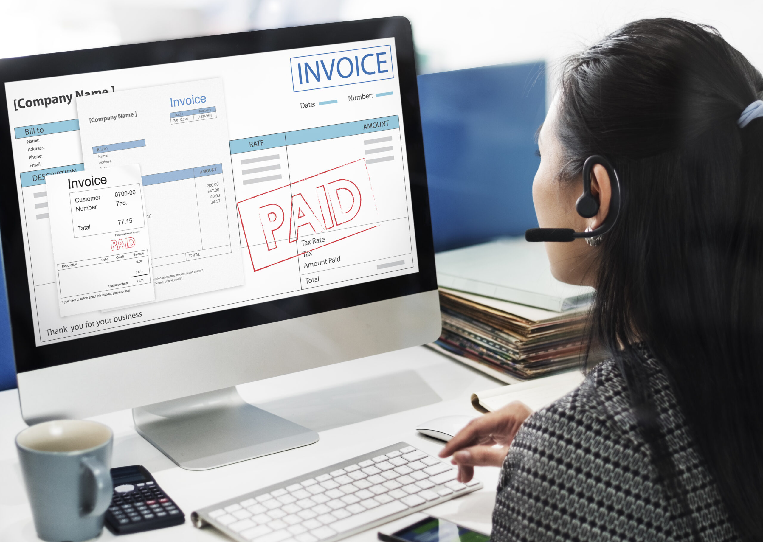 Perth business owner reviewing an unpaid invoice and planning debt recovery steps