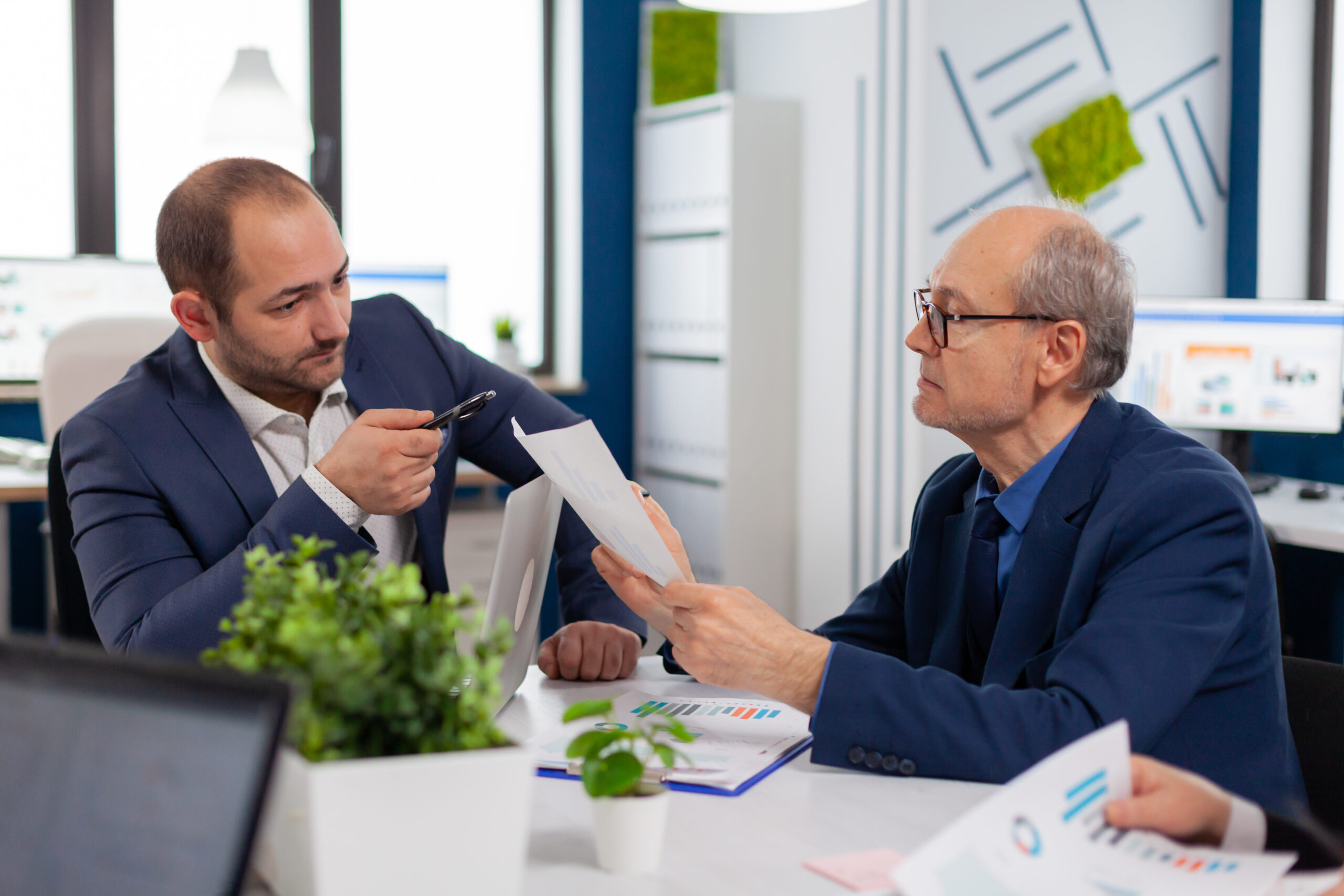 Perth business owner reviewing an overdue unpaid debt and considering whether to use a debt collection agency.