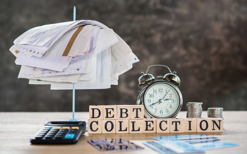 Business professionals reviewing debt recovery documents and comparing debt collection agencies in Perth, WA Is this conversation helpful so far?