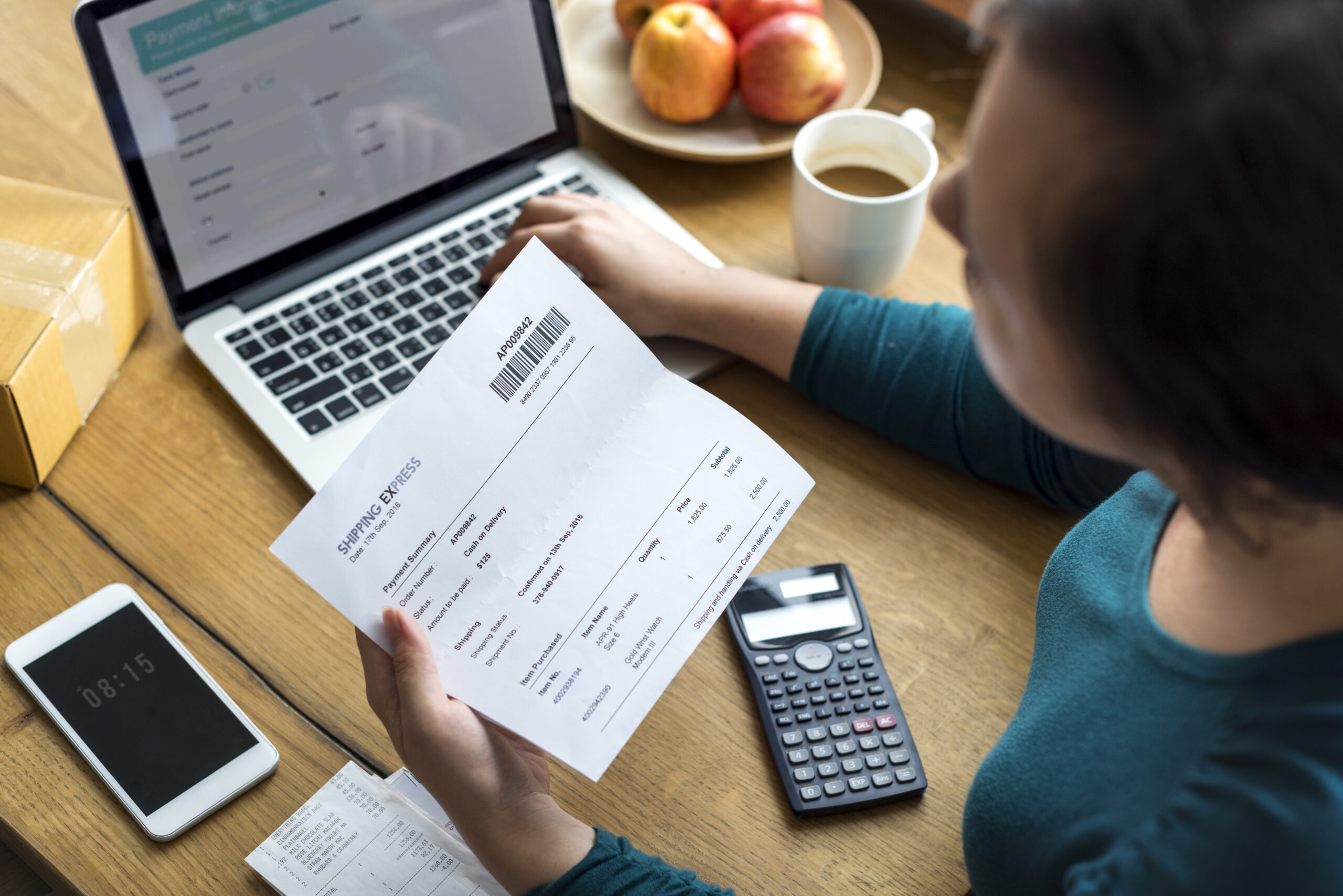 Fremantle business professionals reviewing overdue invoices and financial documents to recover unpaid commercial debts and improve business cash flow.