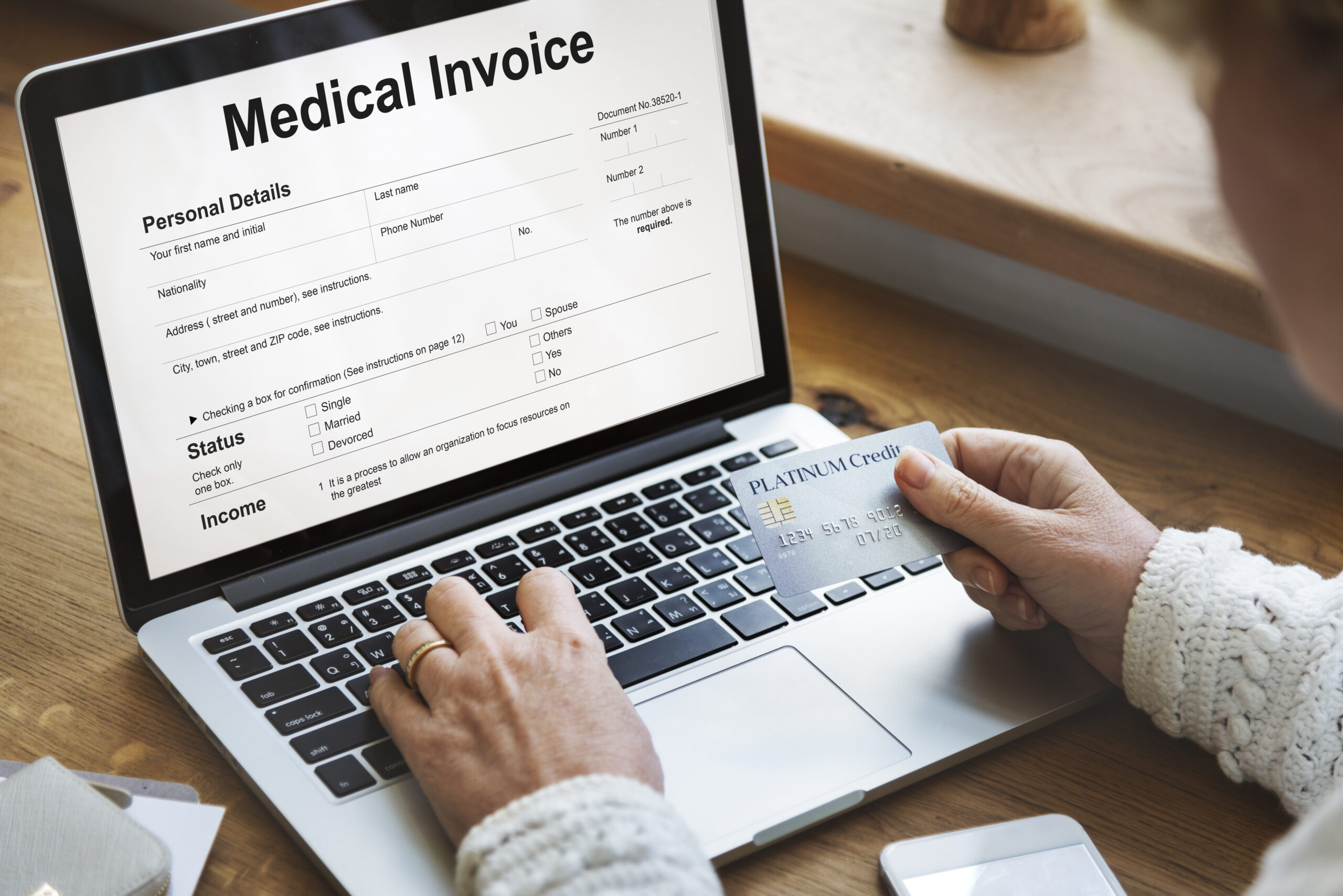 Medical professional reviewing unpaid medical invoices and outstanding patient accounts for a medical practice in Perth, Australia.